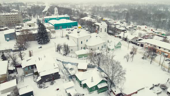Beautiful Winter Cityscape with Small Houses and Trees Aerial View