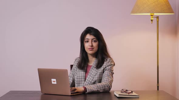 Portrait of Atractive Woman Working on Laptop Computer and Thinking Solving Problem at Home Office