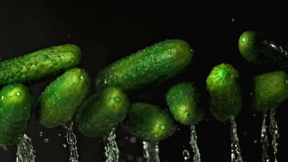 Super Slow Motion Fresh Cucumbers with Water Splashes