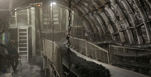 Miner in Black Coal Mine 