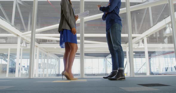 Young man and woman working in a creative office