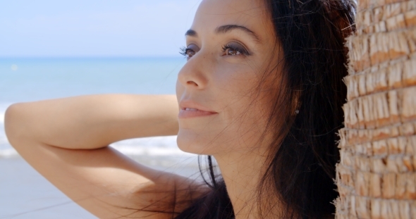 Gorgeous Woman At The Beach Looking Into Distance