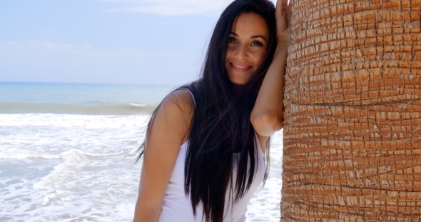 Lady Leaning Her Head Against Beach Palm Tree