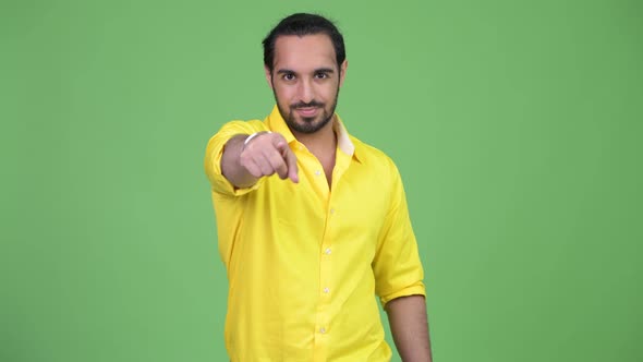 Young Handsome Bearded Indian Businessman Pointing To Camera