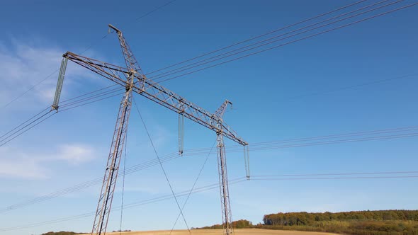 Steel Pillar with High Voltage Electric Power Lines Delivering Electrical Energy Through Cable Wires