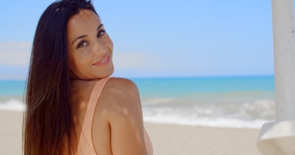 Attractive Lady At The Beach Smiling At Camera