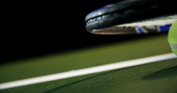 Racket and tennis ball in court 4k