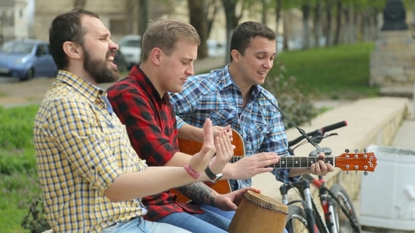 Three Talented Guy Perform On The Street 