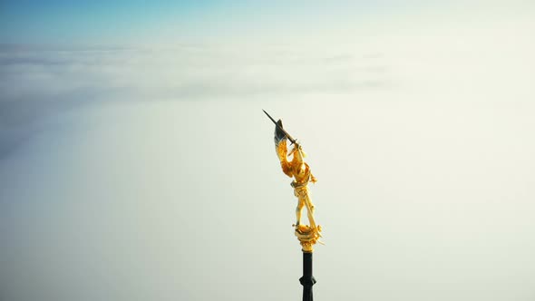 Super Close-up Aerial Shot, Golden St Michael Statue on Top of Mont Saint Michel Castle Fortress