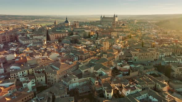 Flight Over Houses and Cathedral in Toledo at Sunset