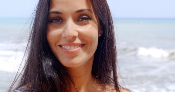 Pretty Woman At Beach With Happy Facial Expression