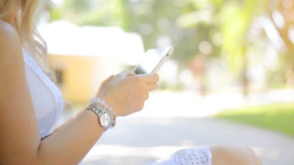 Girl Typing on Tablet PC