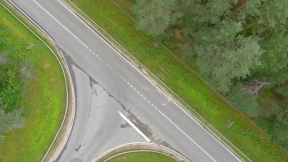 Aerial view rural asphalt road with a beautiful landscape. Drone clips on the Highway in Lithuania