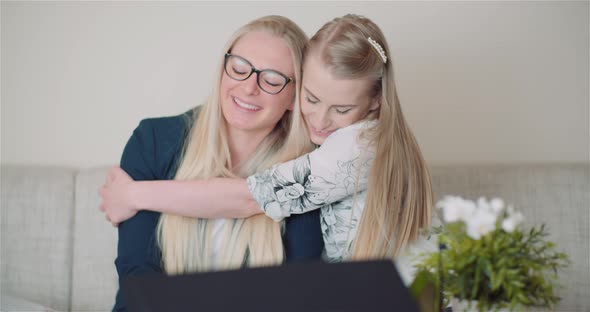 Two Happy Sisters Hugging Together and Giving Support To Each Other Smiling Into Camera