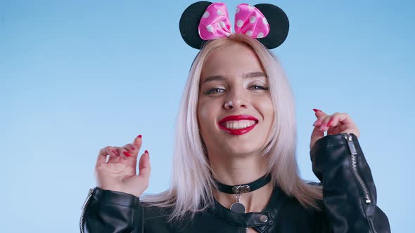 Cute Beautiful Girl in Mouse Ears Posing Playfully on Camera