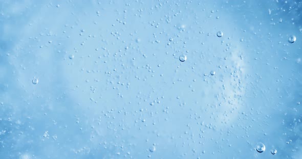 Oxygen Bubbles in Water on a Blue Abstract Background