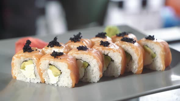 Philadelphia roll sushi with salmon, avocado, cream cheese. Sushi menu. Japanese food.