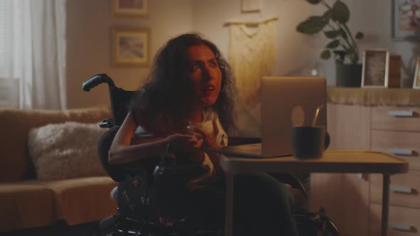 Woman in a Wheelchair Having Video Call