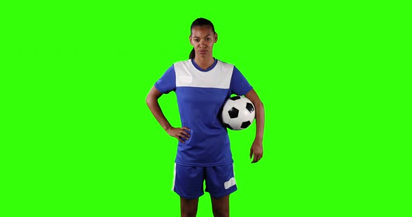 Female soccer player on green screen