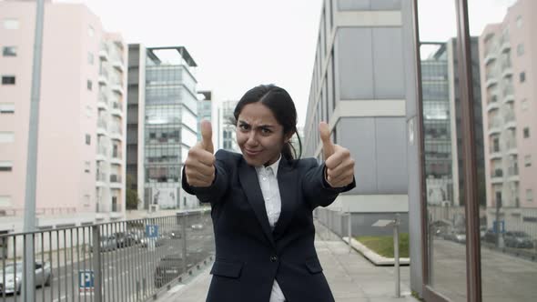 Excited Young Businesswoman Celebrating Success