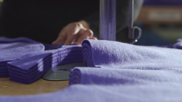 Cutting Fabric on the Table with an Electric Cutter Sewing Production of Clothing