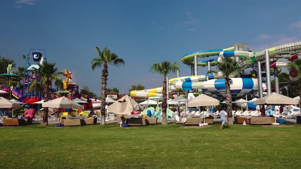 Amusement Park Water Pool with Slides People Relax