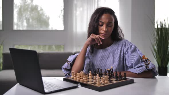 Pretty Clever Woman Playing Game of Chess Online