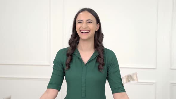 Indian woman throwing money in air