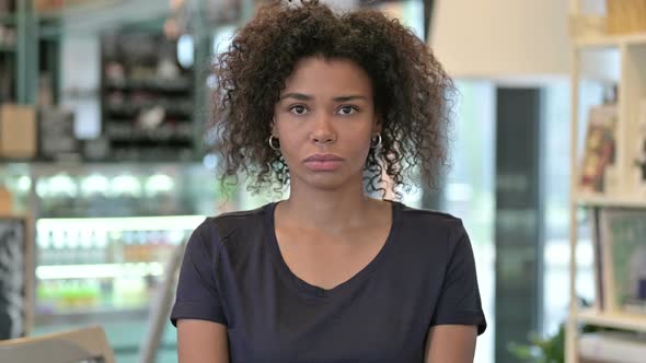 Portrait of Attractive Young African Woman Looking at Camera 