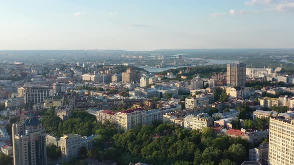 Aerial drone video of downtown skyline buildings and Dnipro river in Pecherskyi district of Kyiv Obl