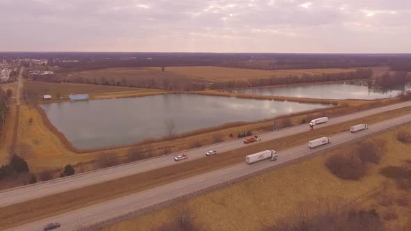 Aerial drone hd footage of the interstate workers located in rural Salem, IL.  They are working on a