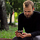 Young Man With the Phone Sitting in the Park - VideoHive Item for Sale