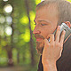 The Young Man With the Phone Sitting in the Park - VideoHive Item for Sale