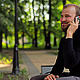 The Young Man With the Phone Sitting in the Park - VideoHive Item for Sale