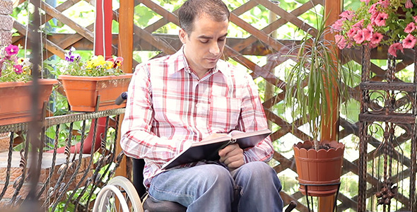 Young Man in Wheelchair Reading 2