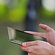 Man With the Tablet Computer on a Bench in a Park - VideoHive Item for Sale