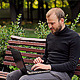 The Young Man Working on a Laptop in the Park - VideoHive Item for Sale