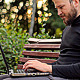 The Young Man Working on a Laptop in the Park - VideoHive Item for Sale