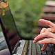 The Young Man Working on a Laptop in the Park - VideoHive Item for Sale