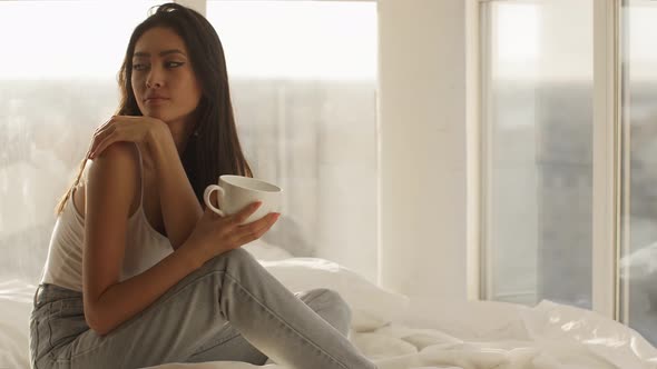 Asian Woman in Bedroom Indoors