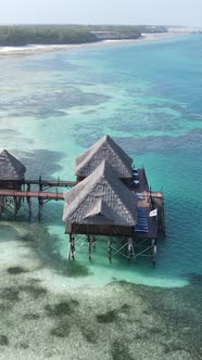 Tanzania  Vertical Video House on Stilts in the Ocean on the Coast of Zanzibar Slow Motion