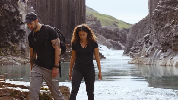 Tourists Walking Away from the Riverside by Studlagil Canyon's Foot, Iceland