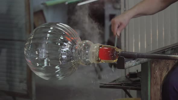 A Sphere Vase is Handcrafted in the Blown Glass Factory