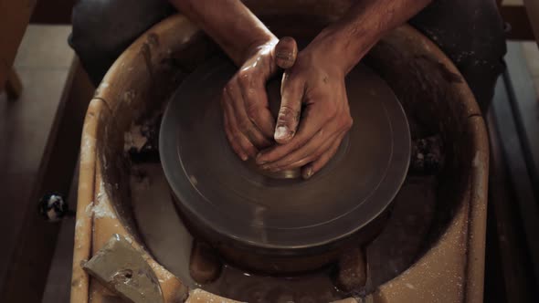 Preparation of a Fresh Piece of Clay for Subsequent Work on the Potter's Wheel