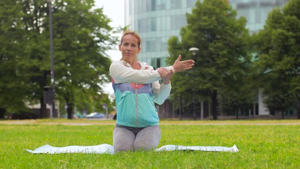 Woman Exercising on Yoga Mat at Park