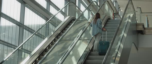 Woman Going Up the Escalator with Her Suitcase, Slow Motion, BMPCC 