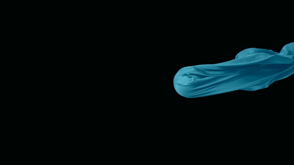 Blue fabric flowing on black background, Slow Motion