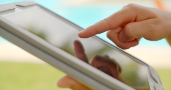 Close Up On Woman Hands While Using Tablet