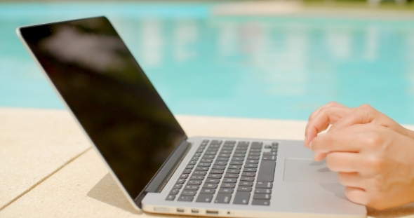 Woman Using Laptop Computer Outdoors alt