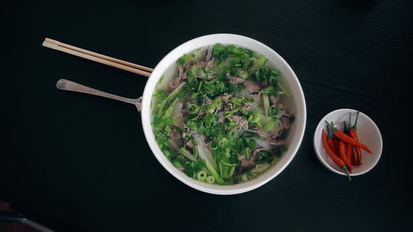 Vietnamese Soup Pho Bo with Chilli Pepper